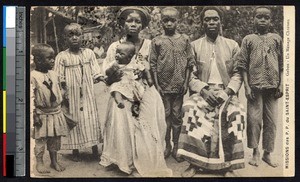 Gabonese husband and wife pose with their children, Gabon, ca. 1900-1930