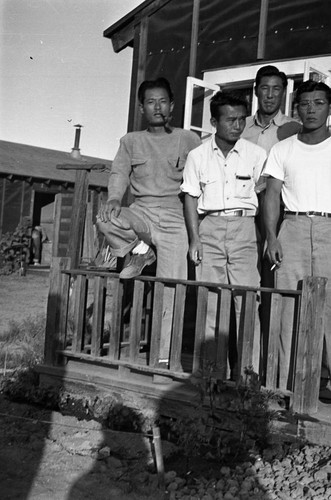 Nisei men on a porch in Jerome camp