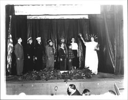 Woman dressed as a Statue of Liberty with a group of scouts in a school pageant, Petaluma, California, about 1952