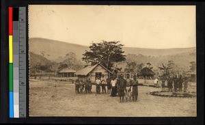 People standing before a small village school, Congo, ca.1920-1940