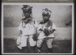 Two pastor's children dressed for a festival