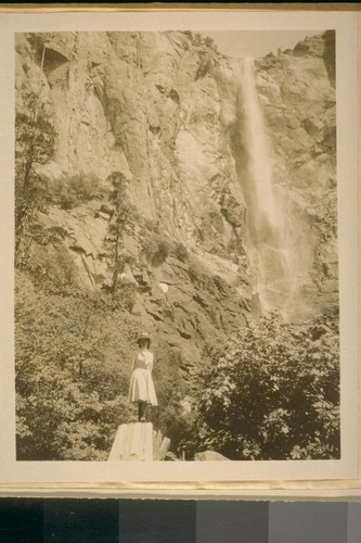 [Woman on tree stump, Yosemite, 1908?]