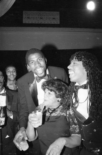 Magic Johnson and Rick James celebrating back stage the American Music Awards, Los Angeles, 1983