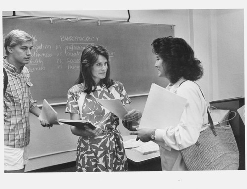 Janet A. Flammang with two students