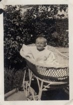 Robert S. Hamilton in baby bed/buggy