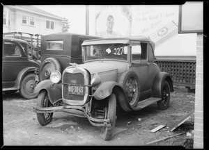 Wrecked Ford coupe at Stark's garage, Southern California, 1930