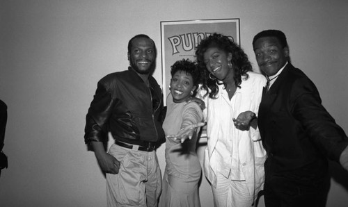 George Howard, Anita Baker, Natalie Cole, and Donnie Simpson posing together at the 11th Annual BRE Conference, Los Angeles, 1987