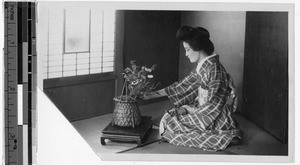 Japanese woman arranging flowers, Japan, ca. 1920-1940
