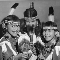 Native American Girls in Costume Hold Feather Fans