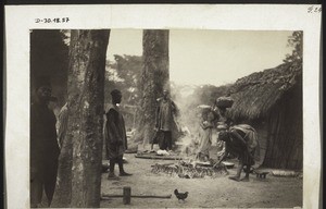 Haussa traders roasting snails in Kumase