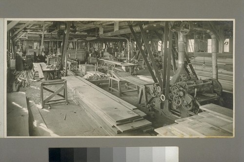 Interior of planing mill. Belt-driven machines