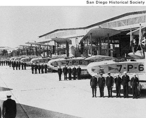 Sailors standing in front of seaplanes at the North Island Naval Air Station