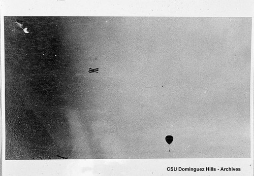 Airplane and balloon in flight