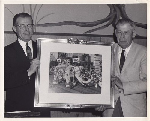 Two Men with Framed Photo of 1959 Float