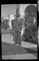 PFC H. H. West, Jr. poses on the walkway in front of H. H. West's residence, Los Angeles, 1944