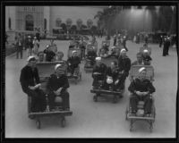 Sailors riding push carts at the California Pacific International Exposition in Balboa Park, San Diego, 1935-1936