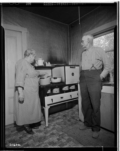 Mr. and Mrs. Pickens and oil stove