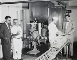 Four men standing in the cottage cheese department of the Petaluma Cooperative Creamery, about 1952