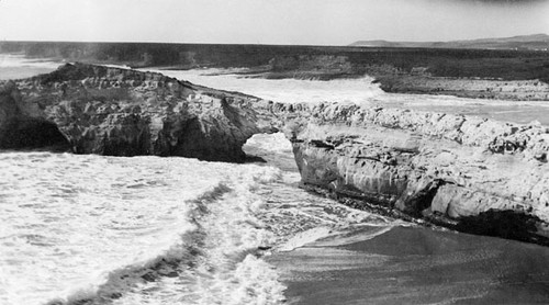 Beach and cliffs, with natural arches