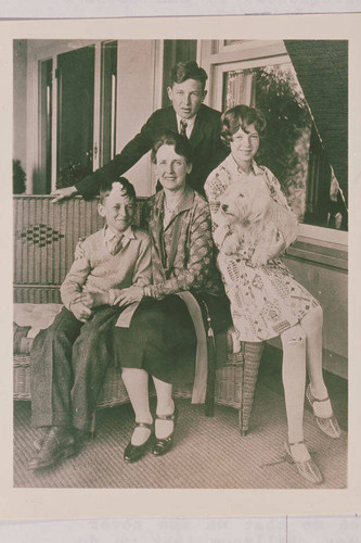 The Will Rogers Family (left to right) Jim, Betty, Mary, and Will Jr. (standing in back) on the porch of their Beverly Hills home