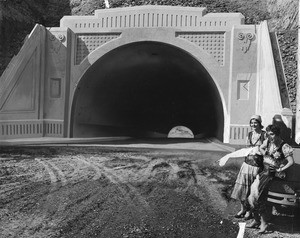 Sepulveda Tunnel portal photograph retouched to include Gypsy women in foreground, 1930