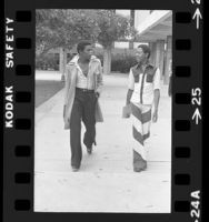 Two Fairfax High School students dressed in fashion of their day in Los Angeles, Calif., 1975