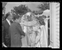 Vice-President Richard Nixon shaking hands with spaceman and spacegirl at Disneyland, Anaheim, 1959