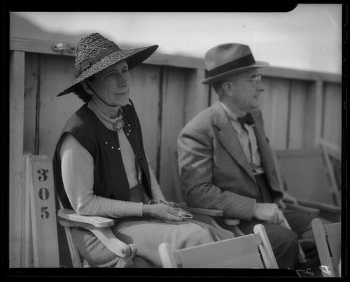 Two spectators at the Palm Springs Field Club during the Desert Circus Rodeo, Palm Springs, 1938
