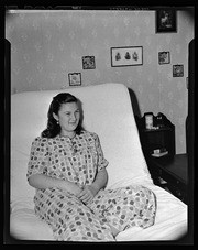 Woman sitting in bed, California Labor School