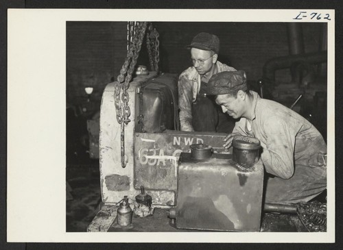 Harry Yanaga, formerly of Gardena, California, and the Colorado River Center, with a fellow worker at the International Caterpillar Company