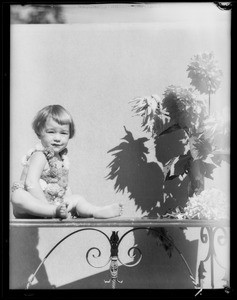 Little girl & dahlias, Southern California, 1933