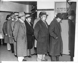 "This contingent of Santa Barbara County Japanese, who were rounded up in alien enemy raids under direction of FBI, shown leaving county jail yesterday en route to Midwest internment camps."--caption on photograph