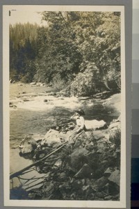 [Unidentified woman at river bank.]