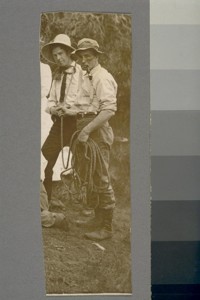 [Unidentified men at gathering. Cropped portion of a larger photograph.]