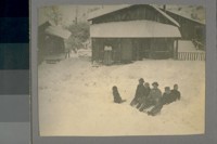 [Unidentified persons and dog in snow.]