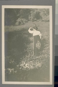 [Unidentified woman with feathers in hair.]