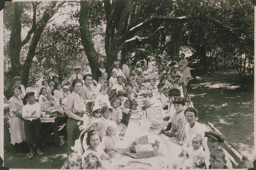 Crowd of women and children gathered for a neighborhood picnic in Temescal Canyon, Calif