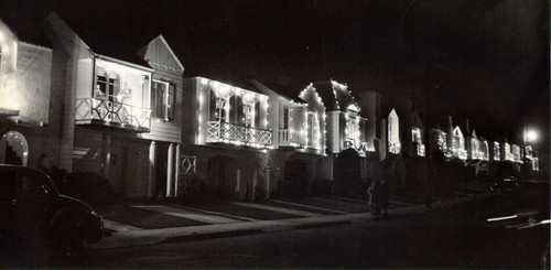 [Houses on 18th Avenue at night, lit up and decorated for holidays]