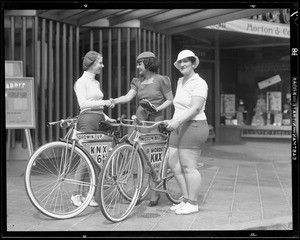 KNX publicity, girls on bicycles, Hollywood Boulevard, Los Angeles, CA, 1933