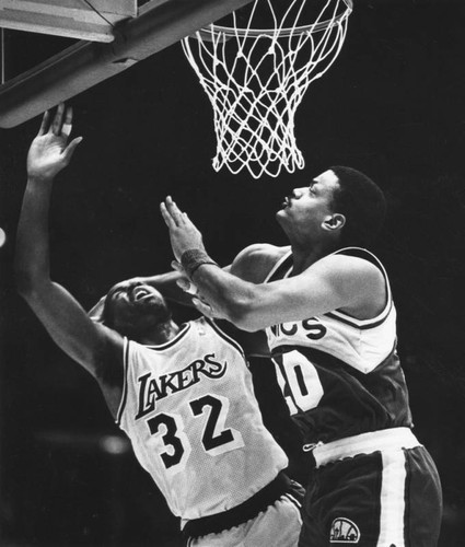 Maurice Lucas takes a shot off of Magic Johnson's face in the finals