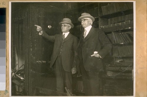 L. to R.: Capt. of Police Lackmann and Jesse B. Cook in the Police Photograph Gallery after the fire of Aug. 1925