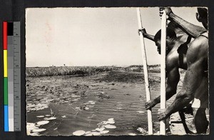 Men in a canoe, Zambia, Africa, ca.1920-1940
