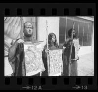 Three Children of God members wearing sackcloth holding signs declaring Judgment Day is coming in Los Angeles, Calif., 1970