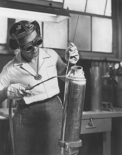 Woman aircraft welder