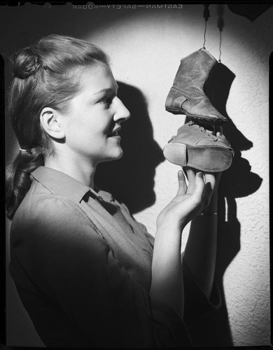 Betty Hanna with child-size shoes, 1941