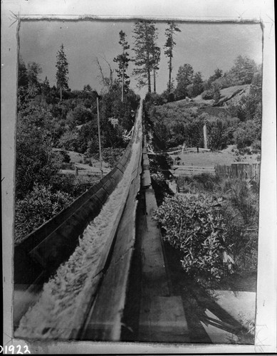 logging, lumber flume, slows lumber clamps coming down, double bottom flume to preent clamps form tearing out flume when water runs out
