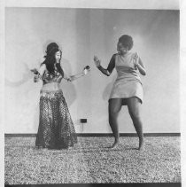 Jodette Johnson, a belly dancer, at her studio, Jodette's Belly Dance Academy, with a student