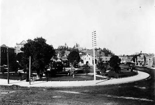 Frontal view (easterly) of Plaza and Church Plaza with Bunker Hill in background and Vickrey/Brunswig building to the left side of the Church