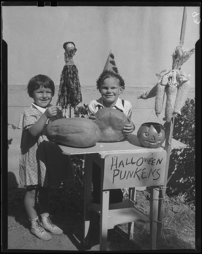 Children at table with Halloween decorations, Los Angeles, circa 1935