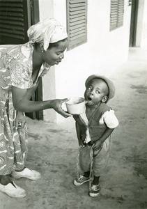 Children taking his medicine, in Ebeigne, Gabon